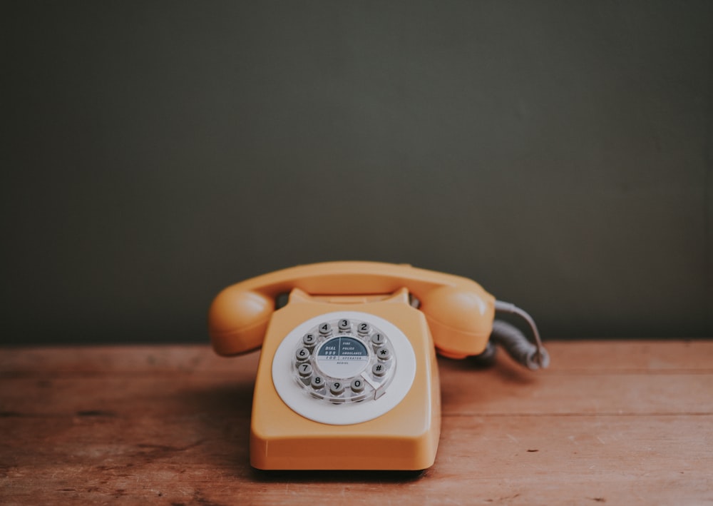 Classic vintage rotary telephone on an editorial desk