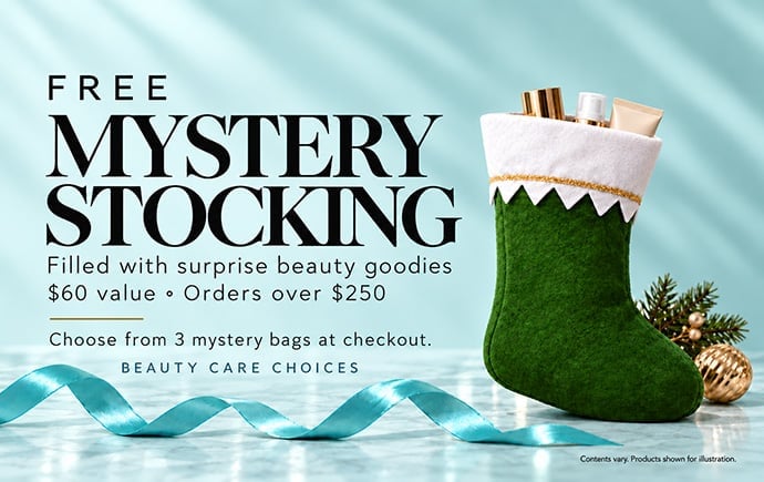 Green Christmas stocking filled with beauty products on turquoise background with blue ribbon