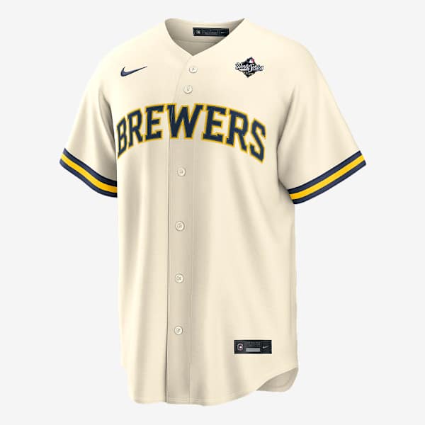 Cream colored baseball jersey with Brewers text and navy blue stripes