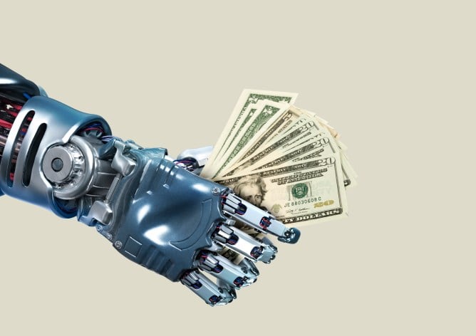 Robotic hand holding fanned US dollar bills against a beige background