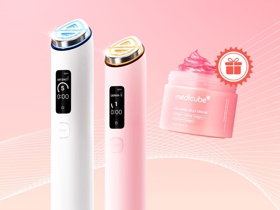 Pink-toned product showcase with two handheld beauty devices and a pink jar of cream on a geometric background