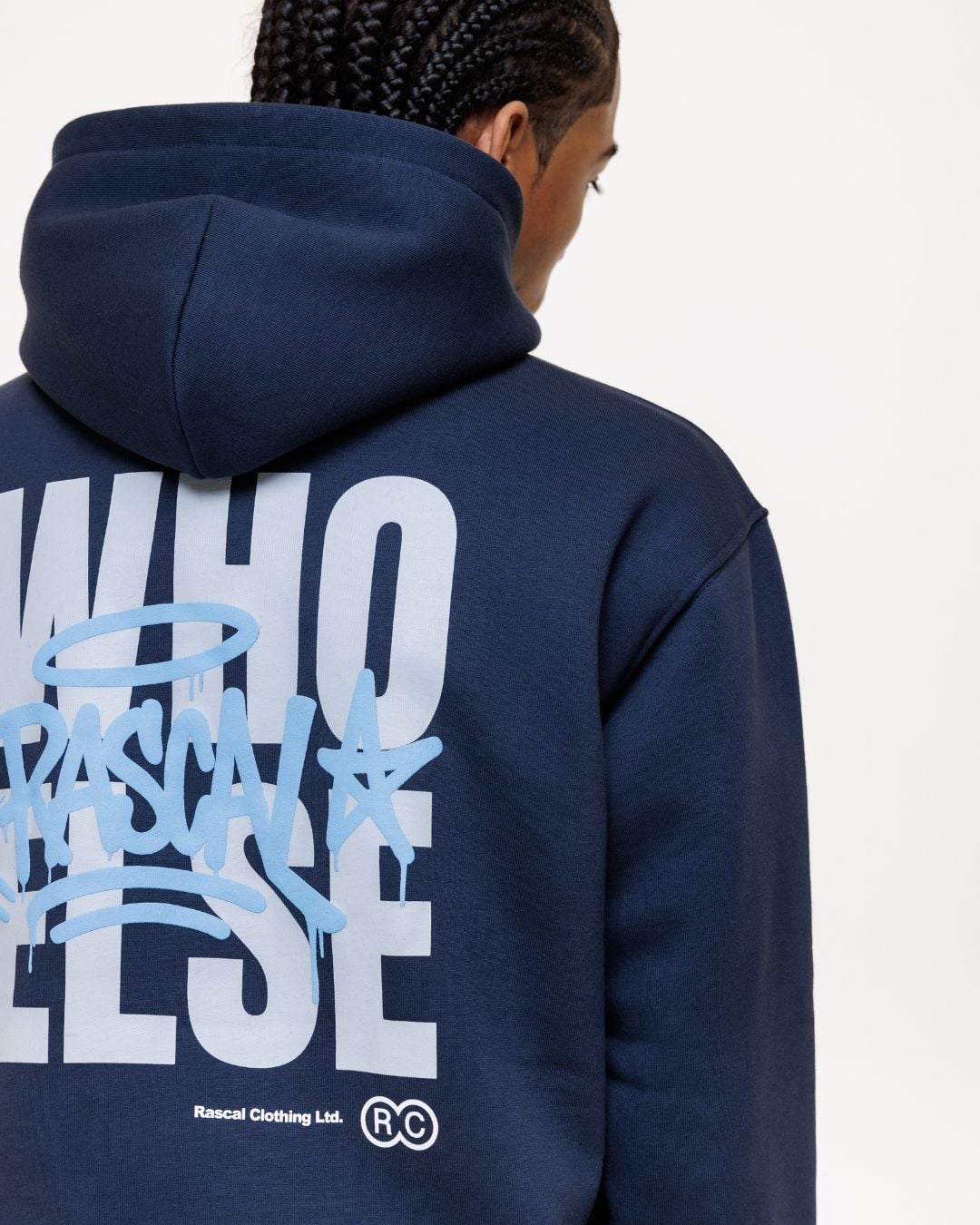 Person wearing navy hoodie with large white text and light blue graffiti-style graphics on back