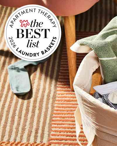 Laundry baskets in earth tones on striped carpet with badge label 'the BEST list 2024 LAUNDRY BASKETS'